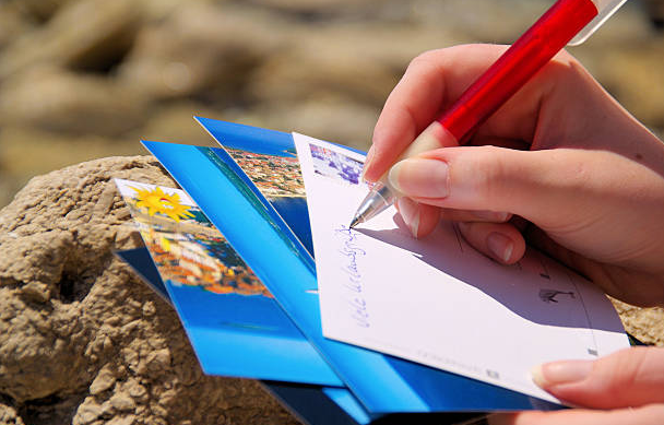 Great Pleasures of Travel is Sending Postcards